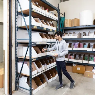 WareSpace tenant Prepfort packing ecommerce orders at a bench in their unit