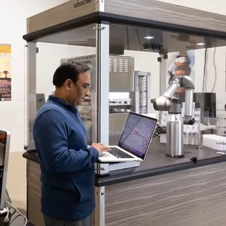 WareSpace tenant RoboChef running an automated kitchen robot from a laptop